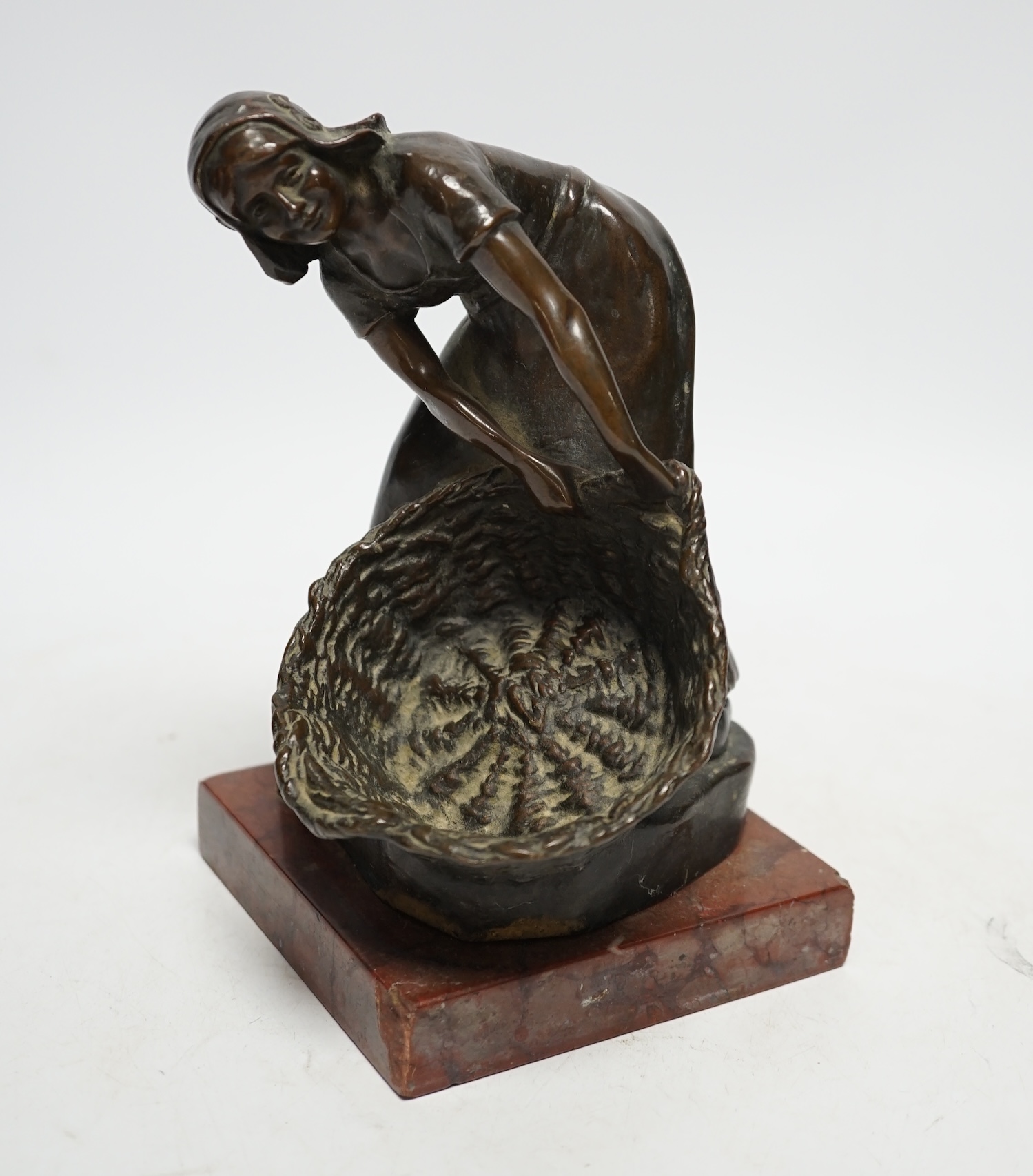 Rudolf Marcuse (German 1878- 1940), bronze of a girl with basket, on rouge marble base, 19cm
